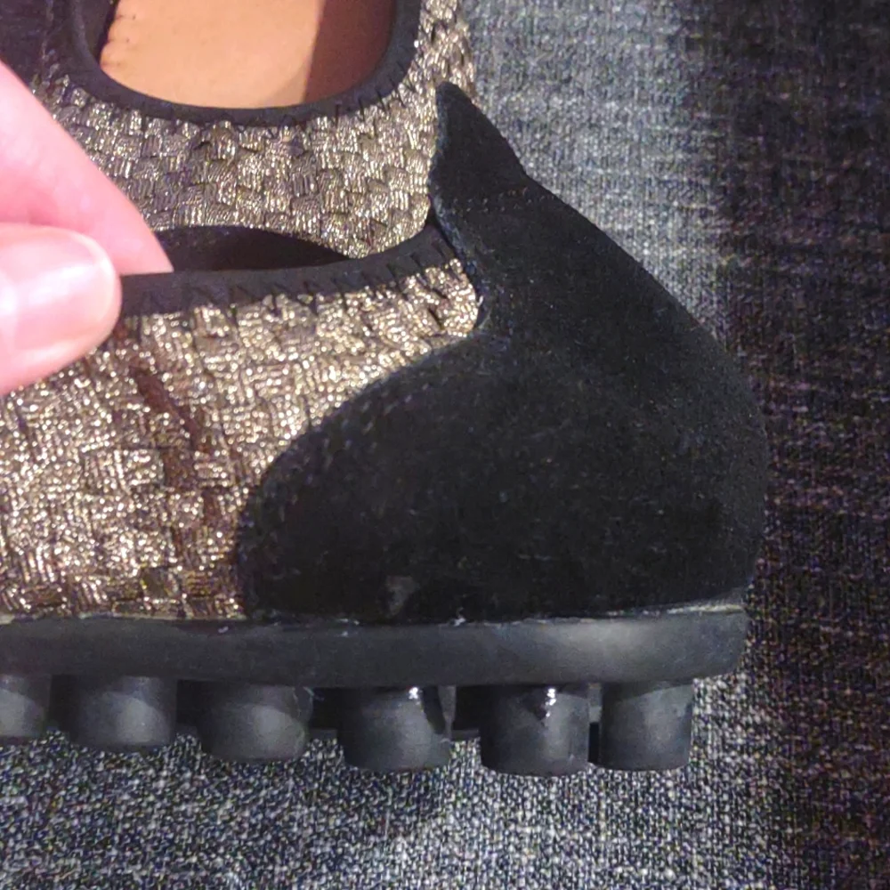 Gold and black flats